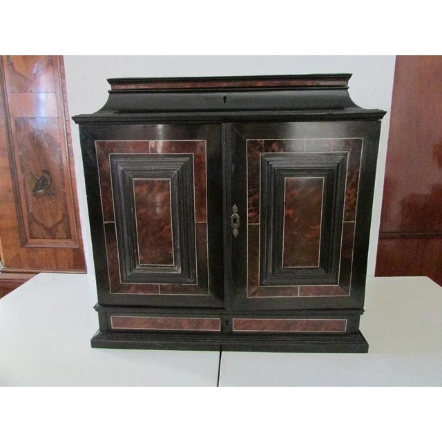 Travel cabinet cabinet in ebony, tortoise and ivory veneered on linden tree, presumably Flemish Antwerp early 17th...