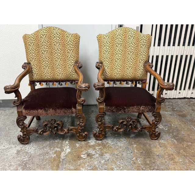 Design Plus Gallery presents a Pair of Bespoke Baroque Carved Wood Armchairs by Provasi. These ornate armchairs showcase...