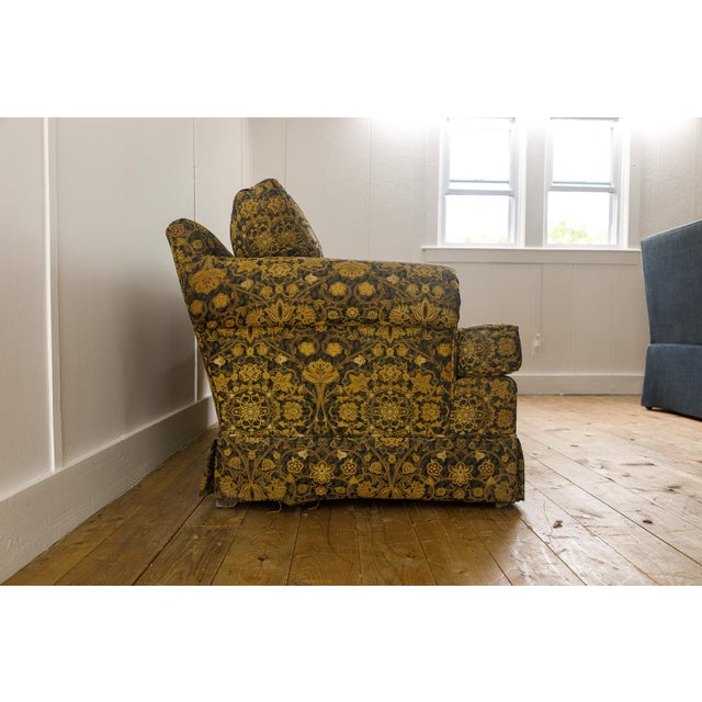 This classic skirted loveseat, attributed to the legendary luxury maker Baker Furniture, is a masterclass in traditional...