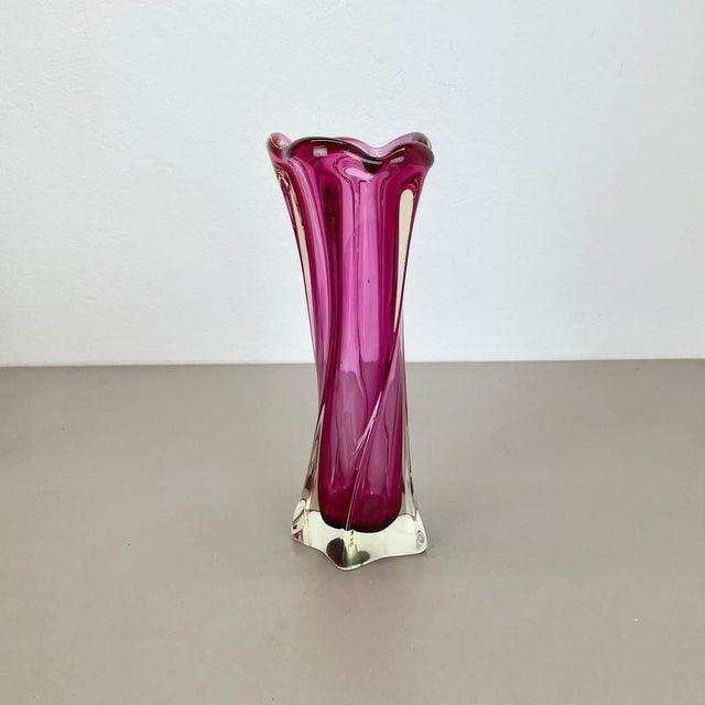 This original vintage glass vases was designed and produced in the 1970s in Murano, Italy. It is made of heavy murano...