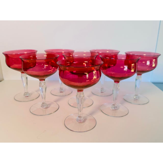 Vintage 1960s Cranberry Iridescent Glass Coupe Stems, Set of 8 Add timeless elegance to your table with this stunning set...