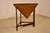 Period Edwardian oak handkerchief table from England. The top is richly grained oak and has a beveled edge. This follows...