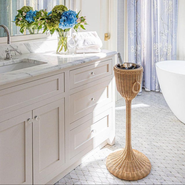 Cheers! Pop some bubbly and celebrate this year with a beautiful wicker champagne stand. Includes a stainless steel bucket...