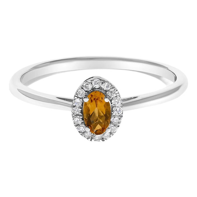 10K White Gold 5X3MM Oval Orange Citrine and Diamond Accent Halo Ring (I-J Color, I1-I2 Clarity) - Ring Size 8 For Sale