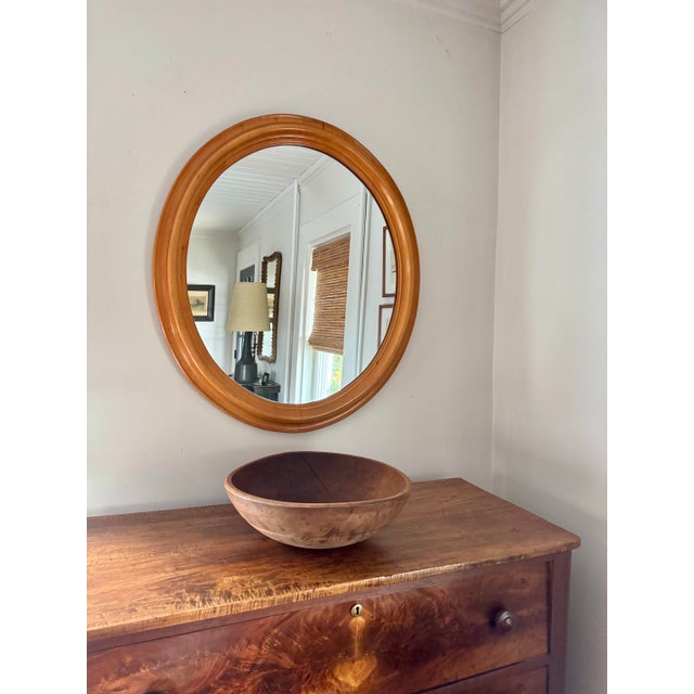 1950s Statton Furniture oval wall mirror with buttery solid birch beveled frame
