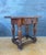 Spanish Renaissance Revival side table crafted in solid oak, Early-20th century. The table features a richly carved drawer...