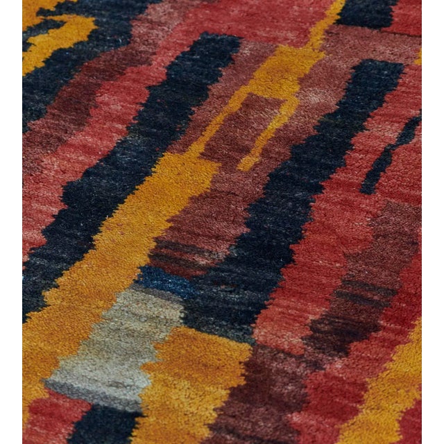 This vintage Turkish rug features a field with an overall design of shaded light red, sandy-yellow, ivory, fox-brown and...