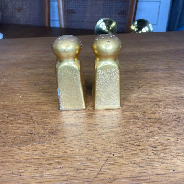 A set of Pickard salt and pepper shakers. Hand painted gold. Made in Japan. Both include the original cork stopper. Both...