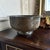 An engraved copper bowl with calligraphic cartouches and geometric floral engraving brings detailed Old World character to...