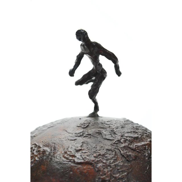Athlete Running across the World. Abstract tabletop bronze sculpture. A beautiful piece that will add to your décor! Size...