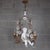 An elegant vintage chandelier in a romantic Baroque style, crafted with meticulous Florentine craftsmanship. At the center...
