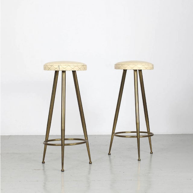 An elegant and timeless pair of Italian bar stools in the style of Gio Ponti, crafted circa 1950s. These bar stools...