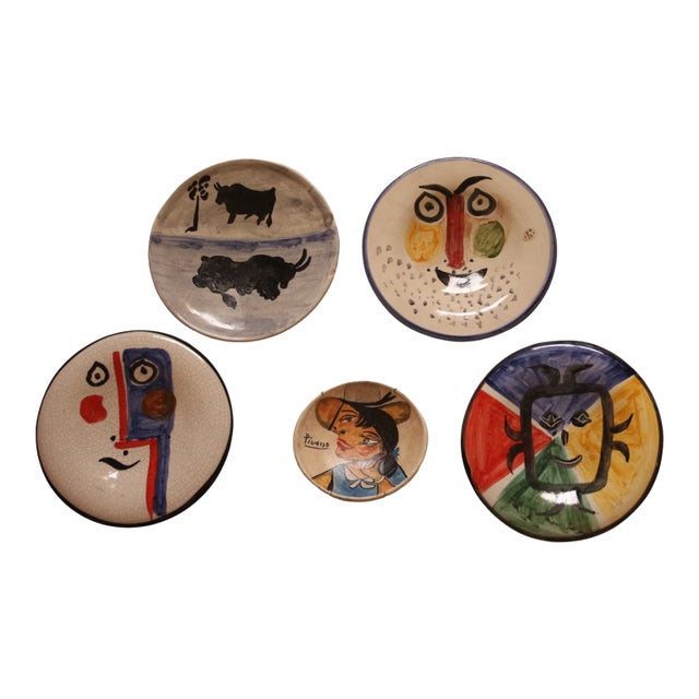 These striking ceramic plates feature what appear to be Picasso signatures along with the Madura pottery seals. Discovered...