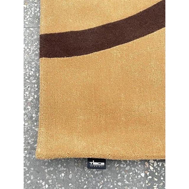 Add a touch of modern elegance to any room with this vintage Tisca rug. Made in Switzerland in the 1980s, this rug will...