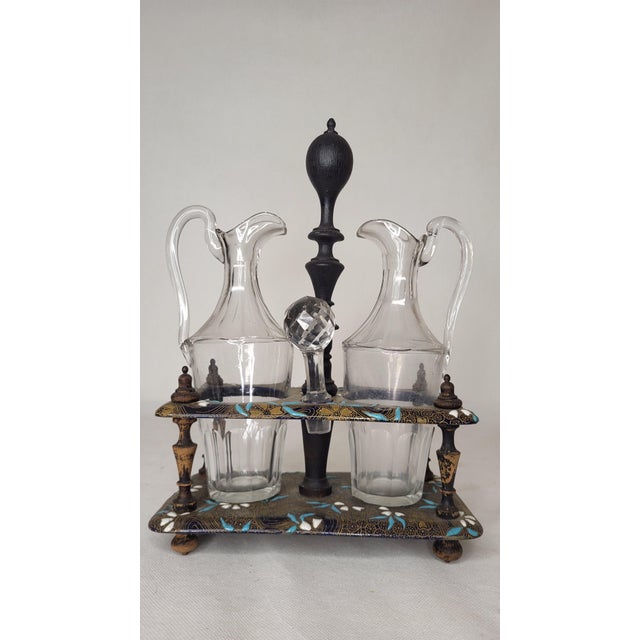 Gien earthenware oil and vinegar server. Glass carafes. Dated by the signature of 1875. This piece has an attribution...