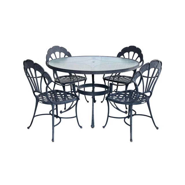 with charcoal powder-coated finish, the round frosted and textured glass top within a conforming aluminum frame raised on...