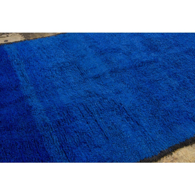 Hand-knotted in wool and originating circa 1950-1959, this 6x9 vintage Moroccan rug joins Rug & Kilim’s Moroccan...