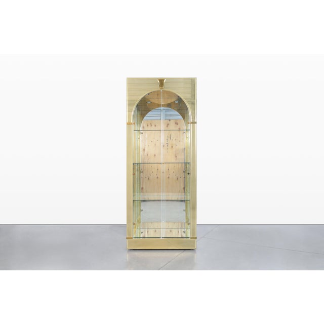 Elevate your interior with this stunning vintage brass vitrine, masterfully designed by Mastercraft in the 1980s. This...