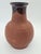 An original, antique vessel made of red utilitarian pottery, likely originating from Europe and dating to the late 19th /...