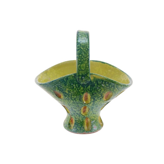 Midcentury Italian hand-thrown terracotta ceramic pottery basket shaped vase glazed in vibrant yellow and green with burnt...