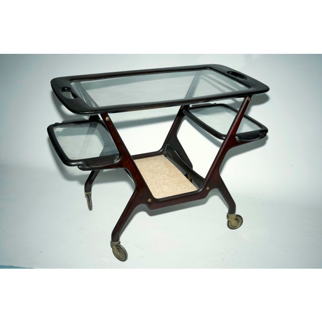 Sophisticated Italian bar cart designed by Cesare Lacca, crafted in the 1950s. The structure is made of beautifully shaped...