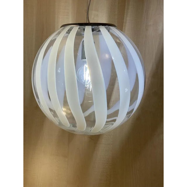 Contemporary transparent and white sphere pendant in murano glass impressive contemporary white and transparent sphere in...