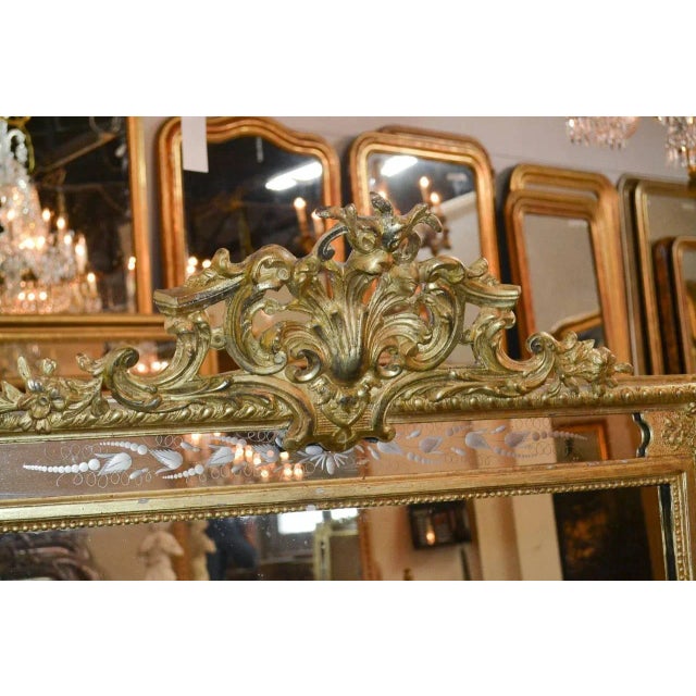Radiant 19th century French carved giltwood mirror with etched glass. Having lovely carved cartouche in acanthus leaf...