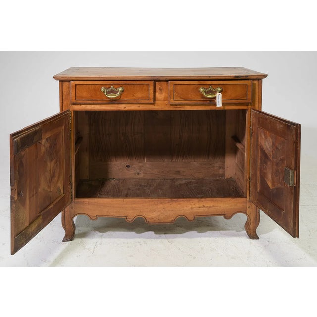 Beautiful 18th-century French Louis XV buffet/sideboard crafted from rich cherry wood. The rectangular top rests above two...