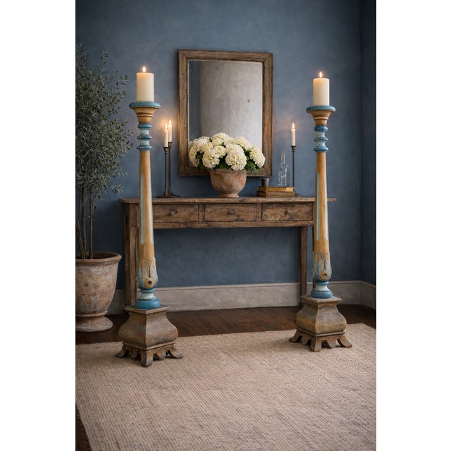 This is a pair of neo-classical revival style carved pine candle stands with original prickets or spikes. The addition of...