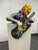 Design Plus Gallery presents a Circa 1989 Bondene Allen Ceramic Figural Rock Star Sculpture + Pedestal Stand. This...