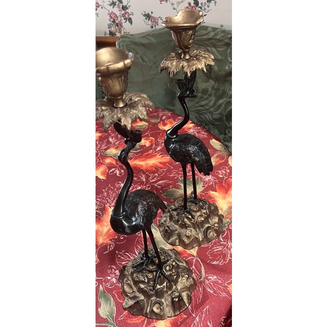 These bronze crane candlesticks date to the Meiji period in Japan (1868-1912), when Japanese artisans created decorative...