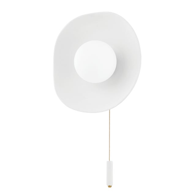 Bacia, meaning bowl in Portuguese, features a matte white ceramic shade delicately surrounding an opal matte globe. A...