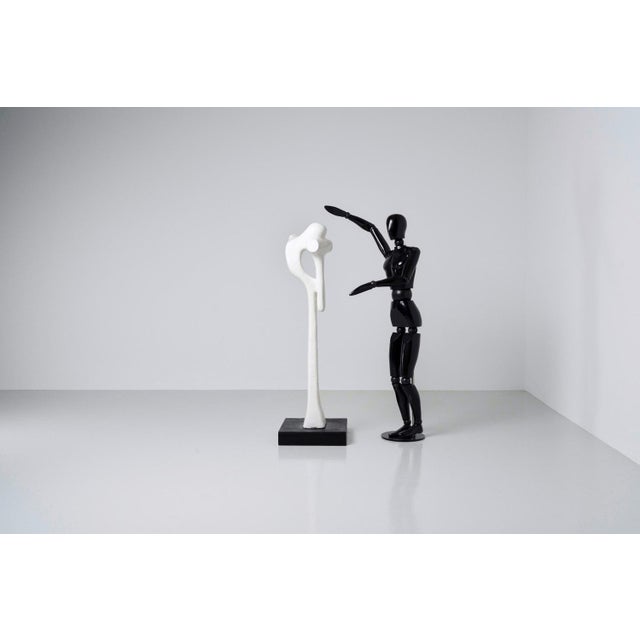 Intruiging and tall sculpture made by Dutch artist Hans van Eerd in 1974. The sculpture is made of painted plaster and...