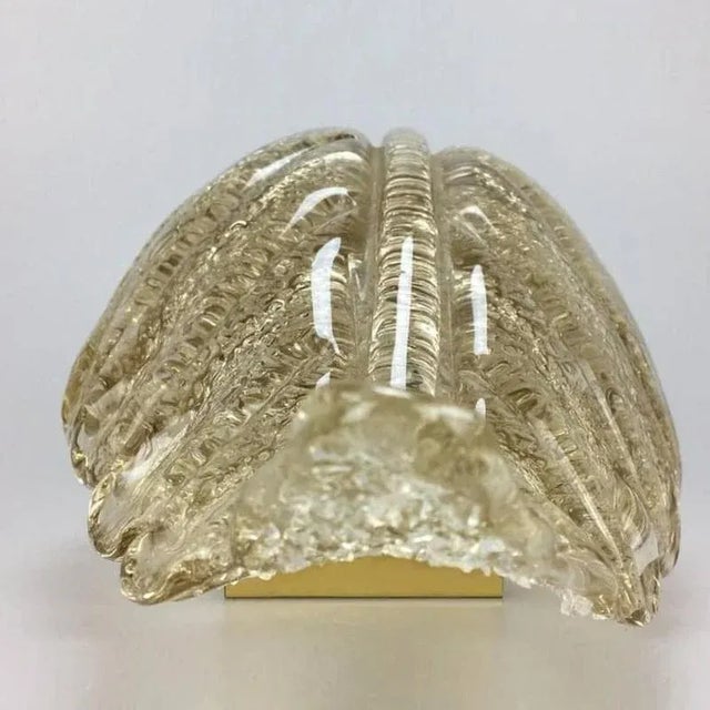 A pair of elegant and exquisite hand blown Murano glass Barovier & Toso wall sconces with special gold inclusions. Each...