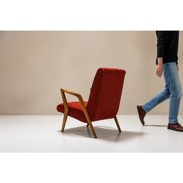 Dynamic and asymmetrical shapes in combination with simplicity in design make this armchair an attractive eye-catcher and...