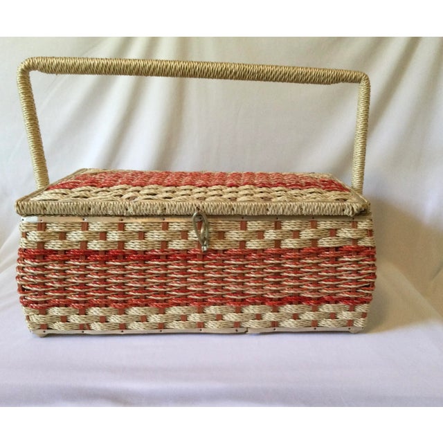 This pink and white vintage sewing basket was made Mid 20th Century. Made of hand woven rattan rope, it has a white and...