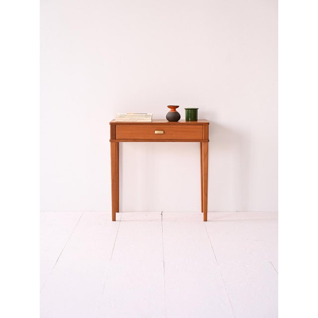 Elegant original 1960s piece of furniture in teak with drawer. Ideal for adding a touch of vintage style to the room. Made...