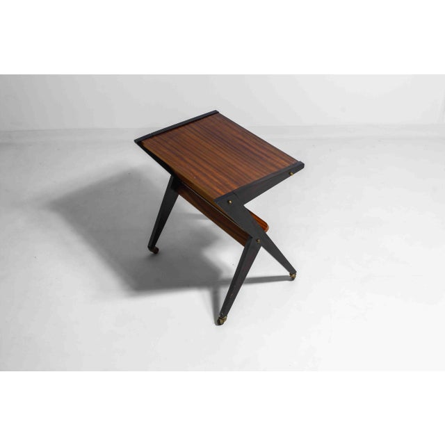 This striking mid-century modern bar cart, originally designed as a television stand by Téléavia in the 1960s, features a...