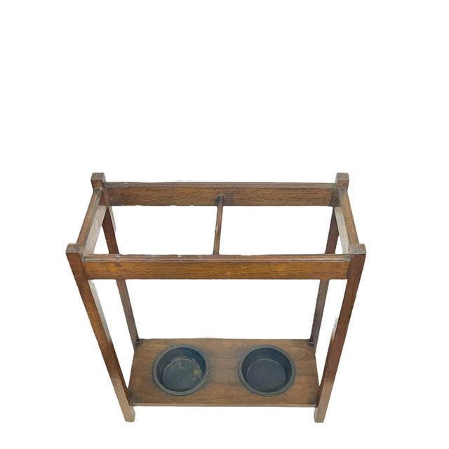 Mission style umbrella or stick stand. Has two removable metal cups. Two sections perfect for walking sticks or tall...