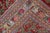 A Persian Tabriz rug, the deep red field with an allover pattern of botehs and thick green leafy vinery within a narrow...