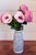 Soft, romantic and effortlessly refined - this arrangement features full fuchsia-pink peonies in pink bloom, artfully...