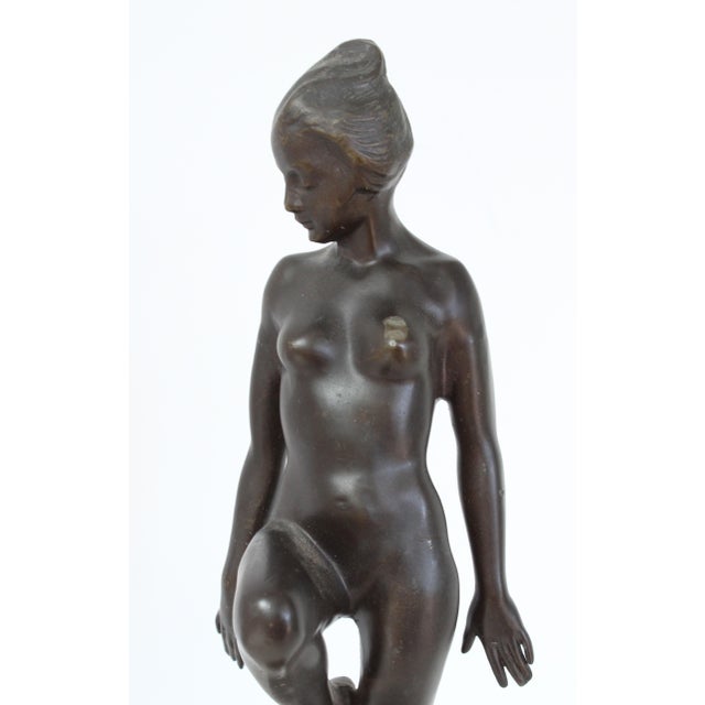 Early 20th Century Art Deco sculpture of a standing nude woman, patinated Bronze. No maker's marks. We think it may have...