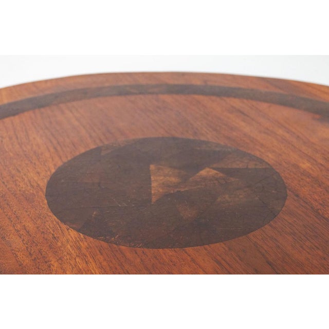 An elegant two-tiered circular table, authentic Indonesian craftsmanship from the 1990s. It comes from a showroom and has...