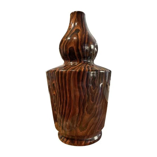 A Chinese glazed vase from the late Republic period. Faux-bois glaze in deep brown and black, imitating woodgrain....