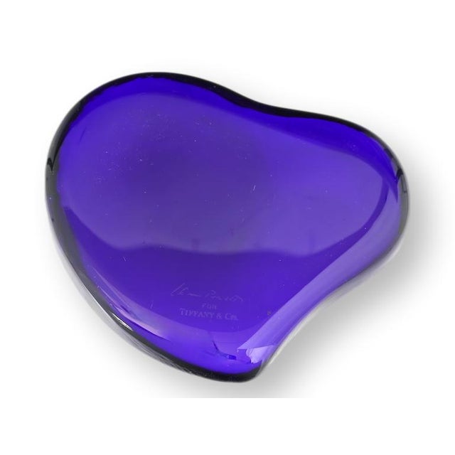 Elsa Peretti for Tiffany & Co. cobalt glass heart paperweight . This sculptural desk accessory features Peretti’s...