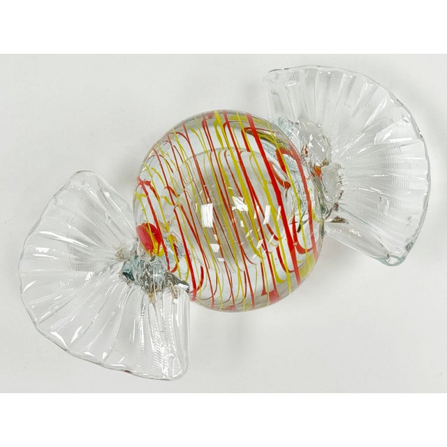 Oversized vintage Murano style blown glass wrap candy. Features vibrant orange and brown swirls in bulb form measuring...