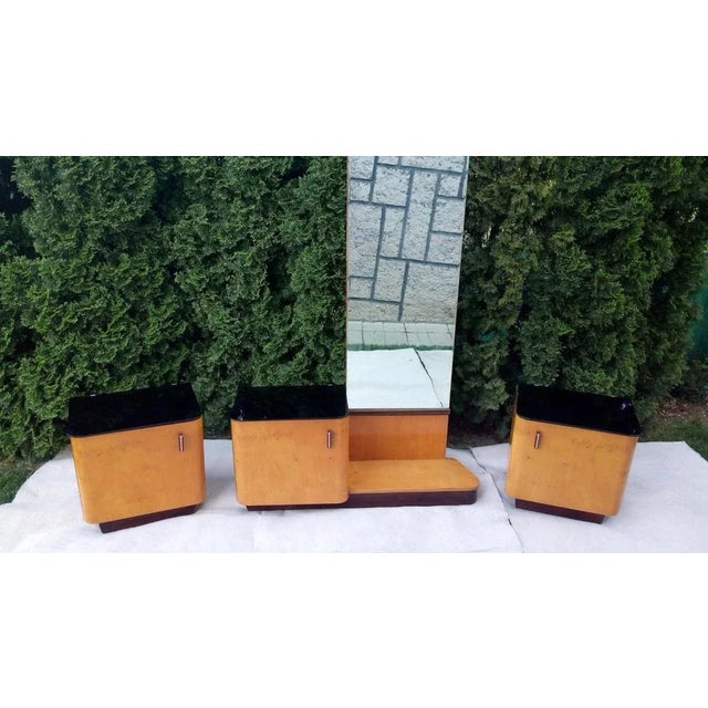 2 bedside tables and 1 table with a mirror in very well.preserved original authentic condition. There is black glass on...