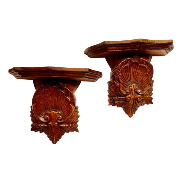 Pair of Vintage Mid-Century Hand-Carved Wooden Wall Shelves Features an Ornate, Deeply Detailed Scalloped Shell Design With a Rich, Warm Wood Finish. For Sale