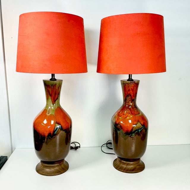Vintage Home is pleased to present this pair of stunning drip glazed ceramic Mid-Century table lamps. The colors are...