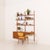 This elegant teak wall unit with a small desk and a dresser was made in denmark in the 1960 -1970s and perfectly reflects...